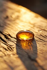 Tocopherol: A single drop of vitamin E oil glistening on a smooth surface, showcasing its rich, nourishing essence.