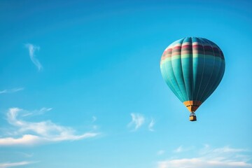 Fototapeta premium vibrant hot air balloon ascends gracefully against vast and clear blue sky surrounded by wispy clouds capturing essence