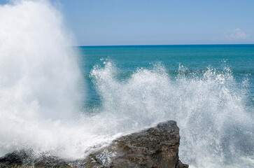 waves crashing on rocks