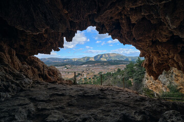 View of the exit from the cave in the mountains