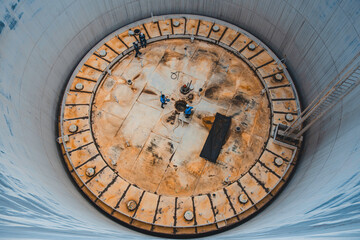 Two male worker inspection visual roof deck plate storage tank