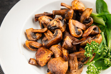 Mushrooms fried champignons vegetables dish fresh delicious gourmet food background on the table rustic food top view copy space keto and paleo diet vegetarian and vegan food