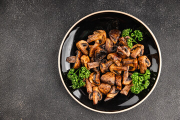 Mushrooms fried champignons vegetables dish fresh delicious gourmet food background on the table rustic food top view copy space keto and paleo diet vegetarian and vegan food