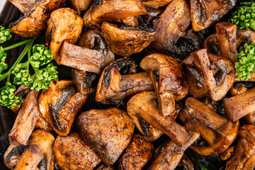 Mushrooms fried champignons vegetables dish fresh delicious gourmet food background on the table rustic food top view copy space keto and paleo diet vegetarian and vegan food