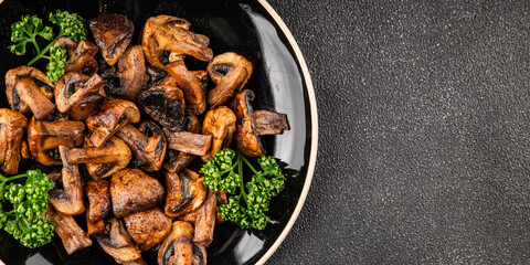 Mushrooms fried champignons vegetables dish fresh delicious gourmet food background on the table rustic food top view copy space keto and paleo diet vegetarian and vegan food