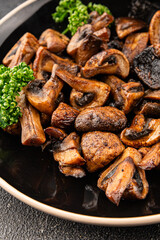 Mushrooms fried champignons vegetables dish fresh delicious gourmet food background on the table rustic food top view copy space keto and paleo diet vegetarian and vegan food