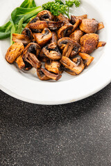Mushrooms fried champignons vegetables dish fresh delicious gourmet food background on the table rustic food top view copy space keto and paleo diet vegetarian and vegan food