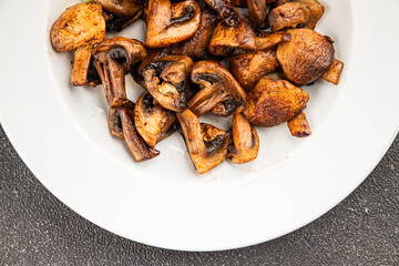 Mushrooms fried champignons vegetables dish fresh delicious gourmet food background on the table rustic food top view copy space keto and paleo diet vegetarian and vegan food