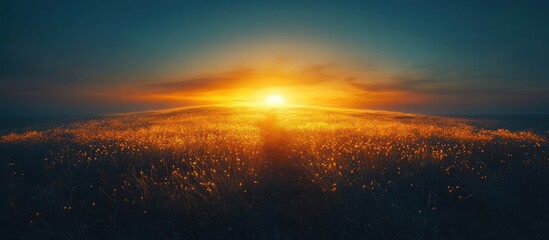 Fototapeta premium Golden sunset over a vast field, glowing horizon