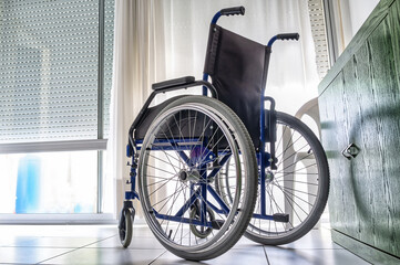 Empty wheelchair inside a room