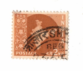 A vintage postage stamp from India isolated on a white background.