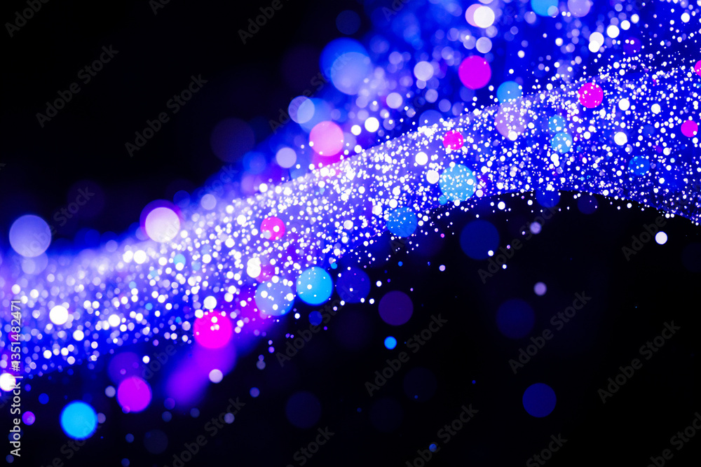 Leinwandbilder a wave of sparkling blue and pink bokeh lights flows across a dark background, creating an abstract 