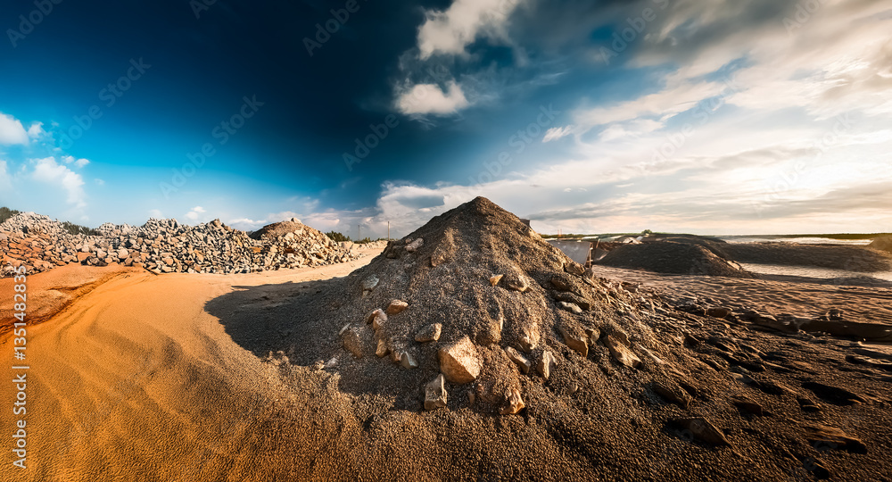 Poster a textured terrain of piled rocks and sand stretches under a bright sky with scattered clouds, creat