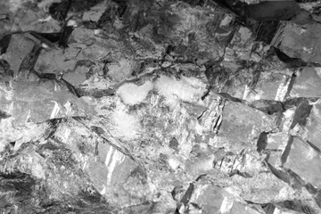 A rock with a lot of cracks and holes