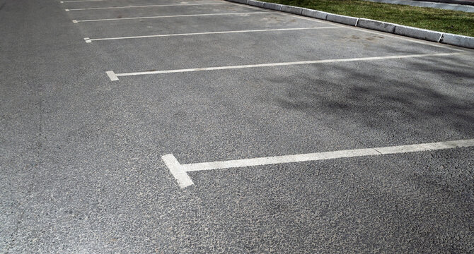Outdoor road markings for parking spaces, empty car park