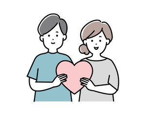 一緒にハートを持つ若いカップル