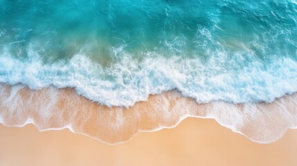 Fototapeta premium Overhead view of a stunning tropical beach featuring pristine white sand, foamy waves, and crystal-clear waters, perfect for summer getaways and travel backgrounds with ample copy space