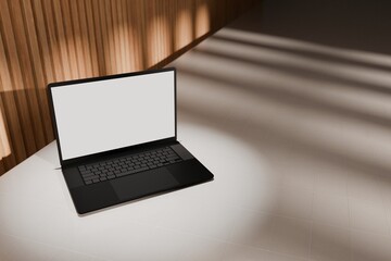 High end laptop on tile studio floor and acoustic backdrop. Blank mockup template screen. Spotlight from above