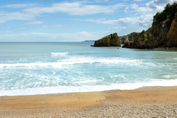 Beautiful view of the sea and the beach with blue sky. Asturias (Spain)