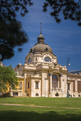 The Széchenyi Thermal Bath, one of Europe's largest spa complexes, showcases a stunning neo-Baroque design. Its classical columns and ornate facade reflect the elegance of traditional bath culture