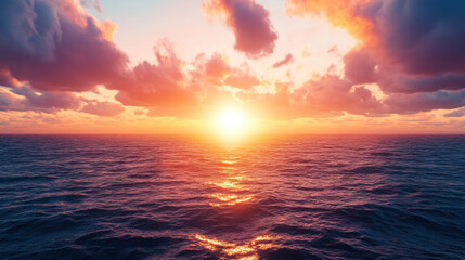 Breathtaking sunset over ocean, with vibrant orange and pink hues reflecting on water surface, creating serene atmosphere