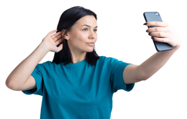 Portrait of a pretty girl taking a selfie isolated over grey background