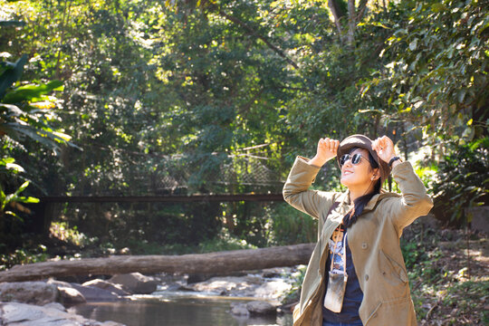Travelers thai women people travel visit Mae sa waterfalls and rest relax outdoor in jungle wild forest in morning of doi suthep doi pui national park at Mae On city in Chiang Mai, Thailand
