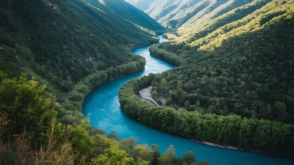 Fototapeta premium Stunning drone view of a peaceful river surrounded by lush greenery and towering hills, emphasizing the beauty of untouched wilderness,
