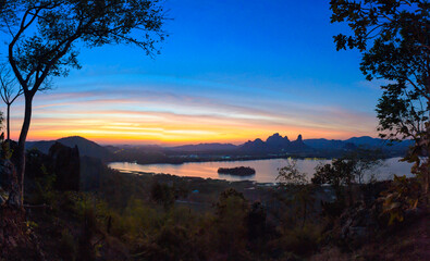 Mountain and lake in sunset at Phu Sub Lek Reservoir, Lopburi, Thailand.