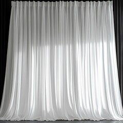Elegant white sheer curtains hanging in front of a window