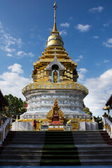 Fototapeta premium Beautiful chedi pagoda stupa of Wat Phra That Doi Saket or Phrathat Doi Saket temple for thai people and foreign travelers travel visit and respect praying buddha at Chiangmai in Chiang Mai, Thailand
