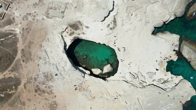 Stunning Aerial Footage of Grotta della Poesia in Roca Vecchia, Puglia: Turquoise Waters, Dramatic Cliffs, and Ancient Ruins Perfect for Travel, Tourism, and Stock Footage Projects &ndash; A Must-See Spot!