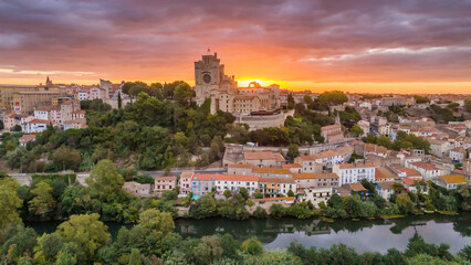 Naklejka premium Aerial view of the historic Beziers Cathedral at sunrise, France.