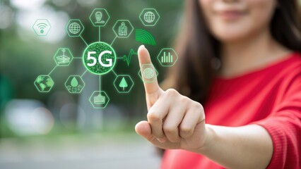 5G network. Woman in red sweater interacts with a futuristic green holographic interface showcasing 5G network technology icons in an outdoor