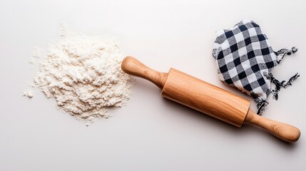 Naklejka premium Flour pile and wooden rolling pin on white background. Baking preparation concept