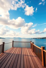 Obraz premium Elevated wooden deck overlooking serene lake, vibrant blue sky with fluffy white clouds, scenic, travel
