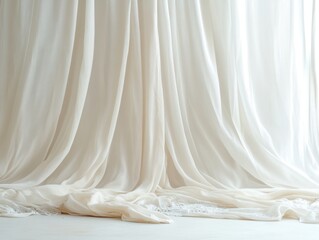 Soft, flowing white fabric drapes elegantly.