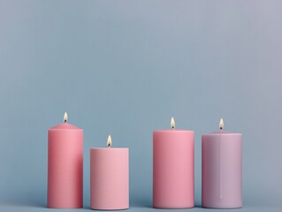 Four colorful candles glowing softly.