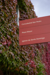 board with directions to key historical sites in vibrant urban area, Spanish city Soria