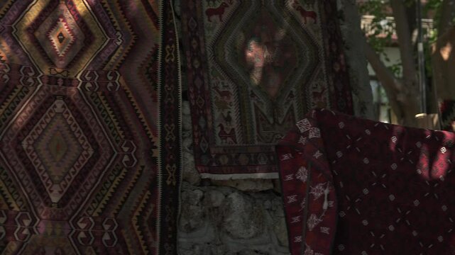 A vibrant display of handmade Turkish carpets featuring detailed geometric patterns, bold colors, and fine weaving techniques that highlight cultural heritage and textile craftsmanship.