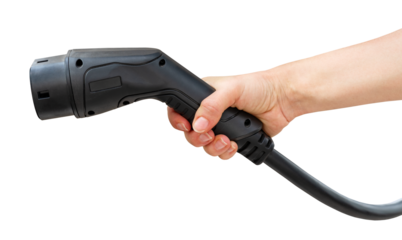 Cutout black electric vehicle charging connector in female hand. 