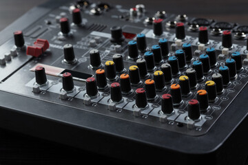 Professional mixing console on table, closeup. Radio studio equipment