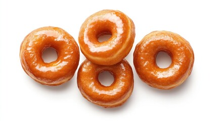 Glazed donuts arranged on white background; food photography for bakery websites