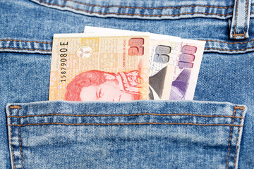 Argentine peso in the pocket of blue jeans