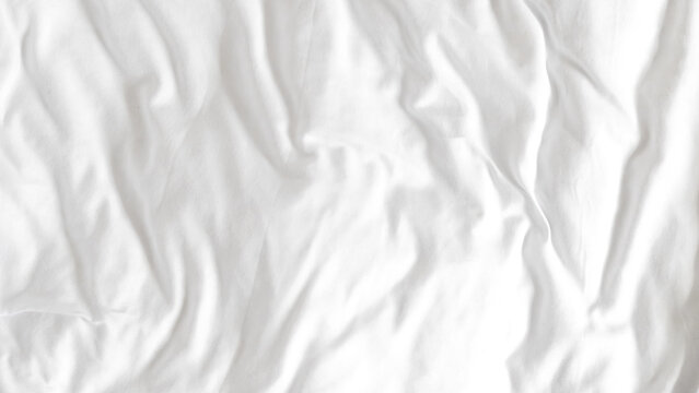 White bedsheet and duvet background with soft textures and minimal style.