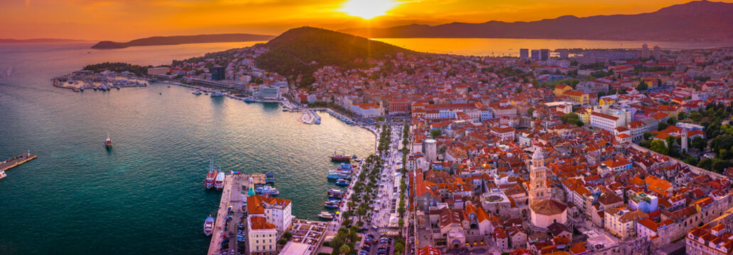 Panoramic view of Split, Croatia, showcasing its historic Old Town, and Adriatic coastline bathed in the warm hues of a stunning sunset, capturing the charm of this Dalmatian city
