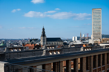 Fototapeta premium High angle view over the city with the Sablon tower and the our lady of the chapel church and the city hall tower, Brussels old town, Brussels Capital Region, Belgium