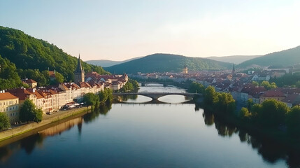 Fototapeta premium Scenic river town sunrise aerial view; tranquil water, historic architecture, lush hills; ideal for travel brochures