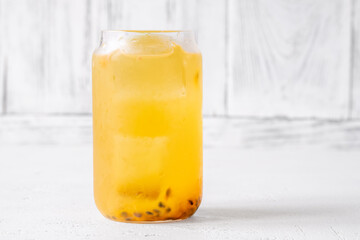 Waltzing Matilda cocktail with passion fruit, gin, and ginger ale in jar glass