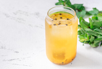 Waltzing Matilda cocktail with passion fruit, gin, and ginger ale in jar glass